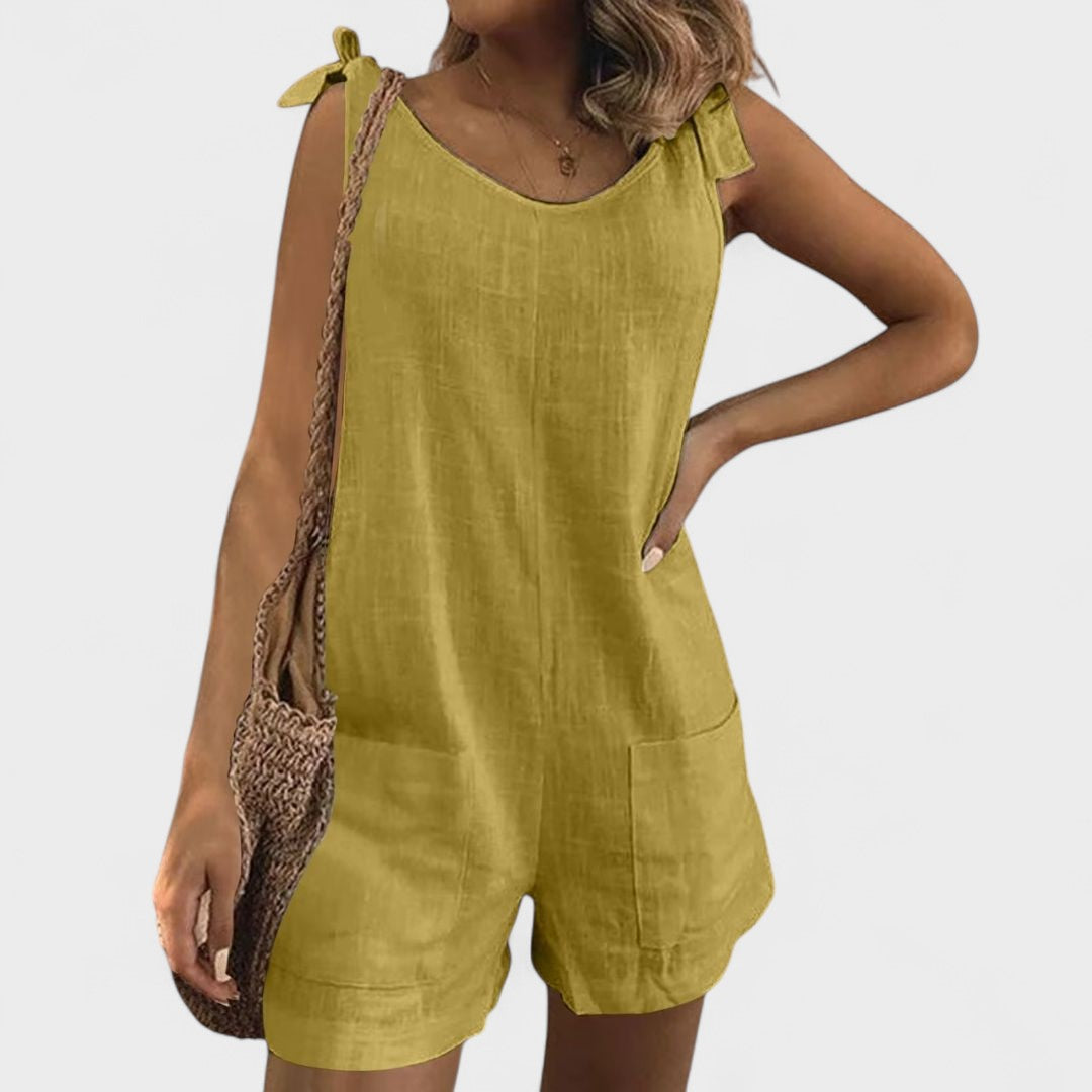 Yolanda | Jumpsuit su kišenėmis ant pečių ir kaspinu